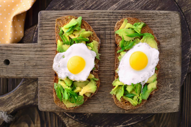 istock avocado quail egg sandwiches in a plate on a wooden cutting board 661692200