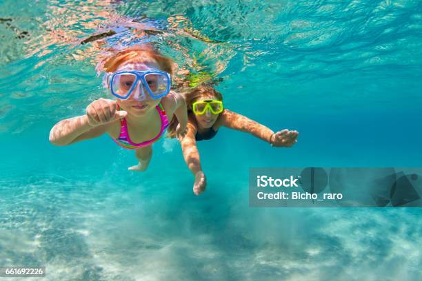 Mother With Child Swim Underwater With Fun In Sea Stock Photo - Download Image Now - Child, Beach, Snorkeling