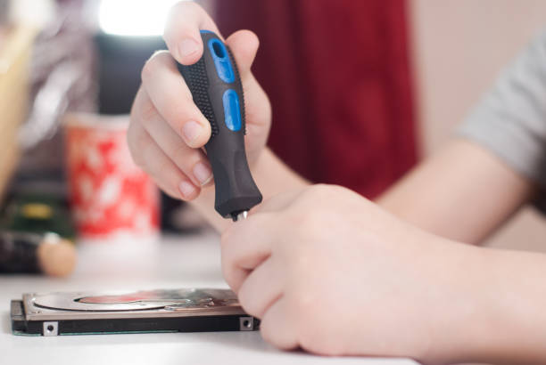 istock Hands of a little boy with the screwdriver, 661692346