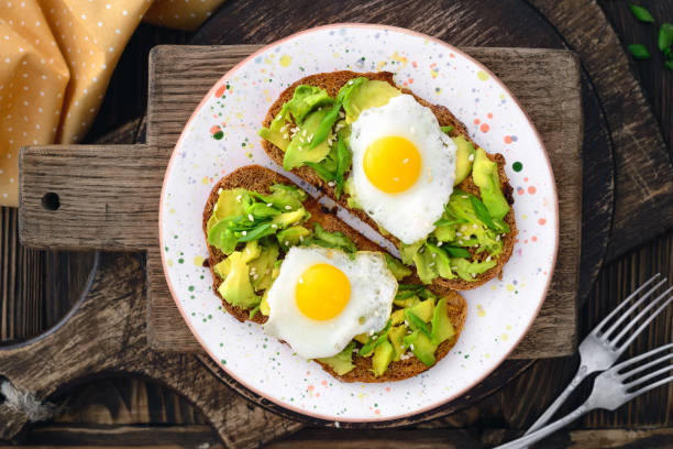 istock avocado quail egg sandwiches in a plate on a wooden background 661692834