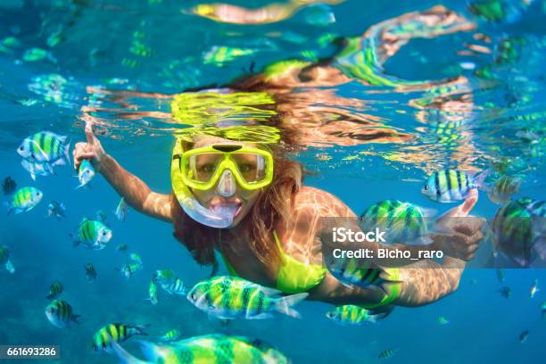 Girl In Snorkeling Mask Dive Underwater With Coral Reef Fishes Stock Photo - Download Image Now