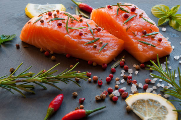 istock Salmon fish fillet with pepper and herbs 661694544