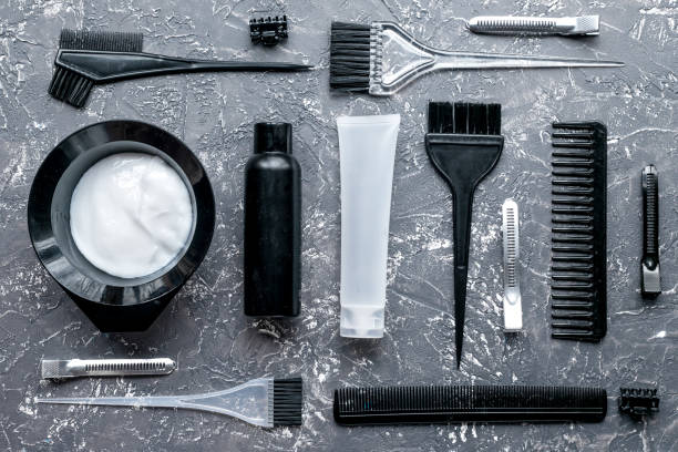 istock hair dye with brush on gray table background top view 661703722