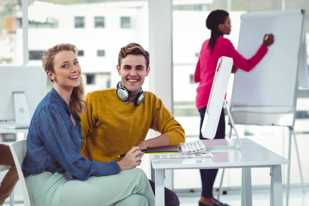 istock Graphic designer wearing headphones at desk 661704314