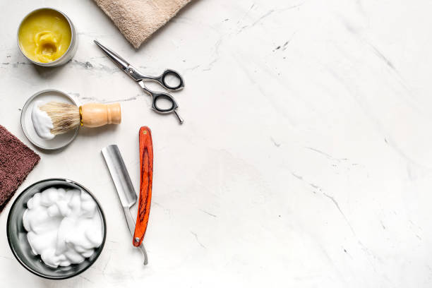 istock Tools for cutting beard in barbershop on workplace background top view mockup 661704878