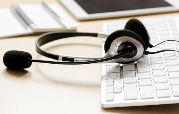 istock headset and keyboard on workdesk for call center concept 661705340