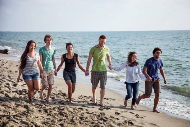 istock Friends on the beach during vacations 661711360