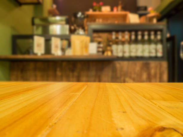 istock wooden table in front of abstract blurred background 661723040