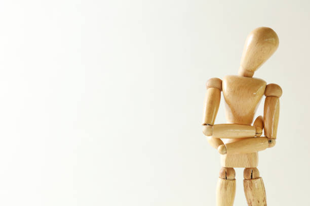 istock Wooden doll posing trouble on white background 661747862