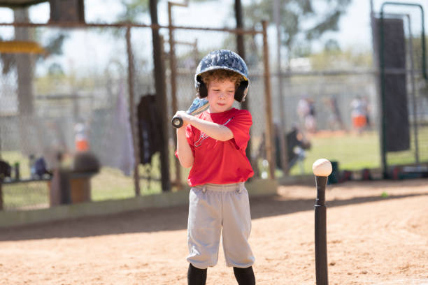 istock Four Year Old Boy Gets Ready to Hit a Baseball During a T-Ball Baseball Game 661777352