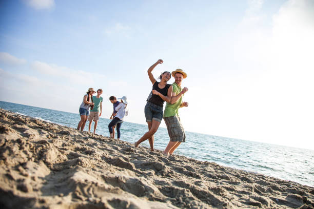 istock Friends on the beach during vacations 661778832