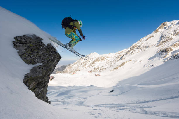 istock Man skiing off piste jumping from a cliff 661799590