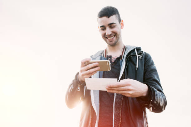 Adult Man Depositing Check with Smart Phone