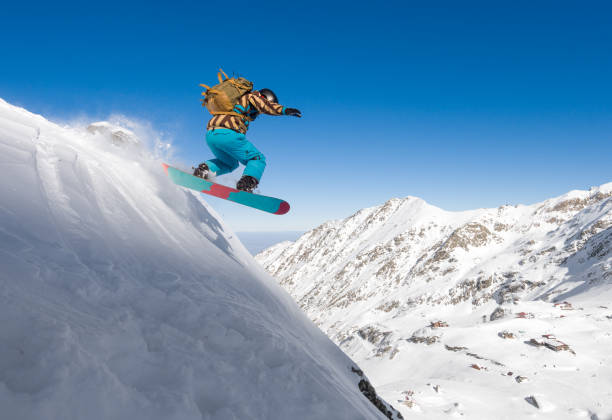 istock Man with snowboard riding downhill steep slope 661800276