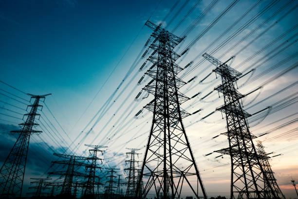 Pylon High voltage towers in the dusk of the evening fuel and power generation stock pictures, royalty-free photos & images