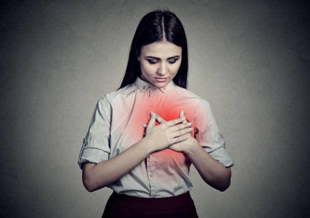 istock sick woman with heart pain 661805660