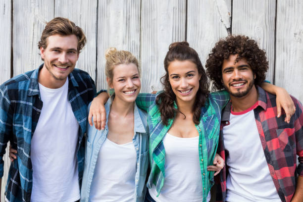 istock Friends standing with arms around 661805864