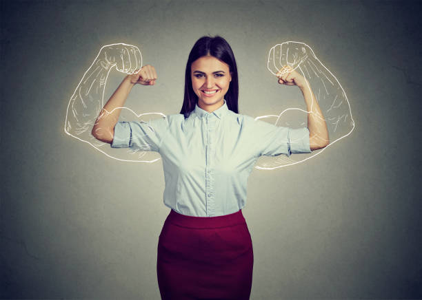 istock Powerful confident woman flexing her muscles 661806228