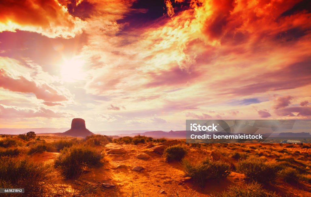 amazing landscape at the sunset at the monument valley national park in arizona USA with cloudy and drama sky Desert Area Stock Photo