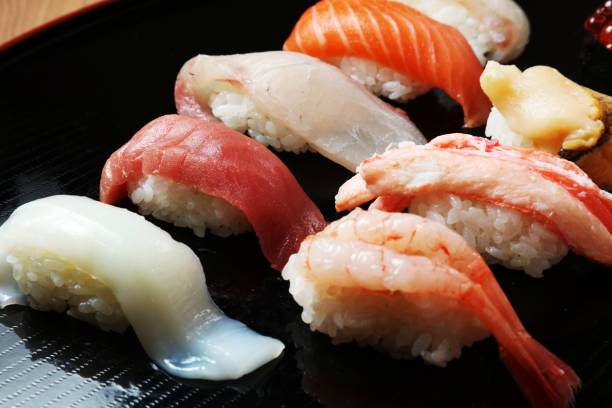 istock Closeup of mixed sushi rolls on a plate 661846778
