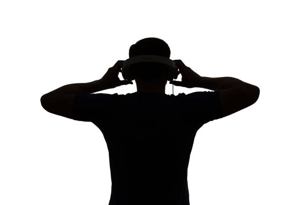 istock Silhouette of a DJ. He is raising his arms. 661852992