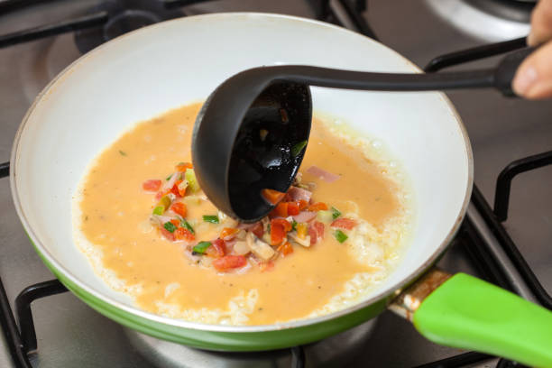 istock Pouring the omelet mix onto a pan 661862578