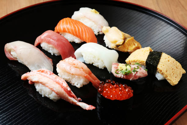 istock Closeup of mixed sushi rolls on a plate 661868984