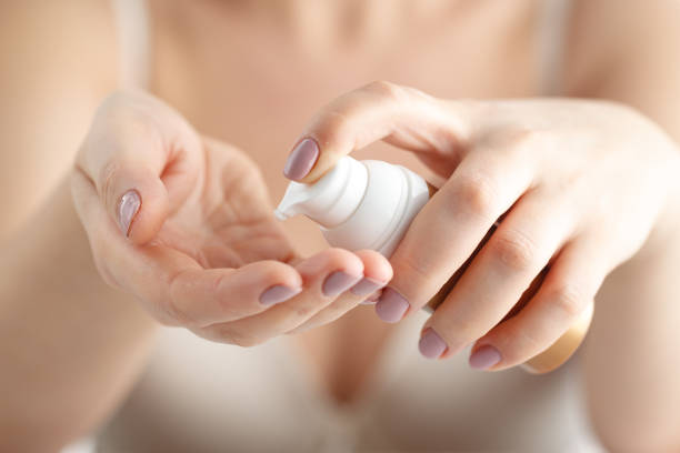 istock beautiful woman hands with cream 661871368