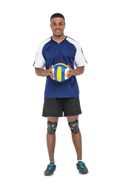 Sportsman holding a volleyball Sportsman holding a volleyball on white background male volleyball player stock pictures, royalty-free photos & images