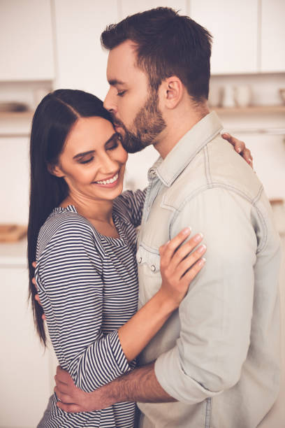 istock Beautiful couple in kitchen 661879950