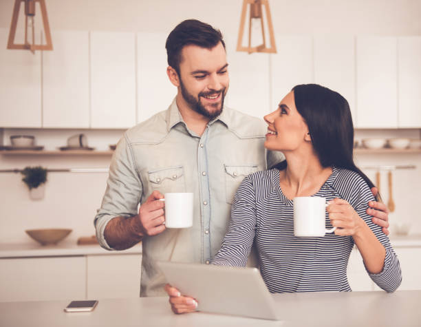 istock Beautiful couple in kitchen 661880422