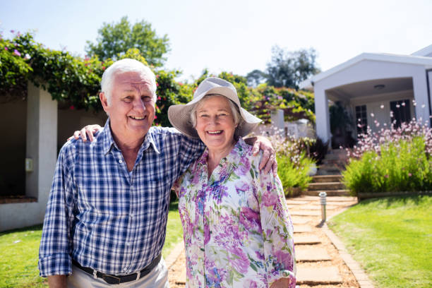 istock Senior couple embracing in the garden 661880968