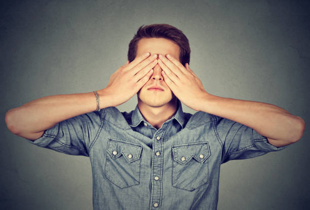 istock Man covering eyes with two hands 661884498