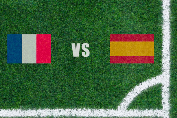 green Soccer Field with white lines and corner. Match France vs Spain. stock photo