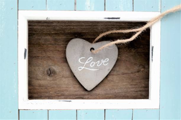 istock light colored frame with a stone heart in the middle 661905460