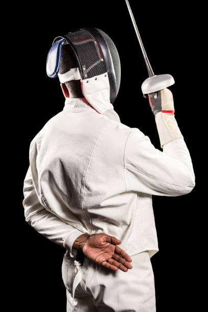 istock Rear view of man wearing fencing suit practicing with sword 661911802