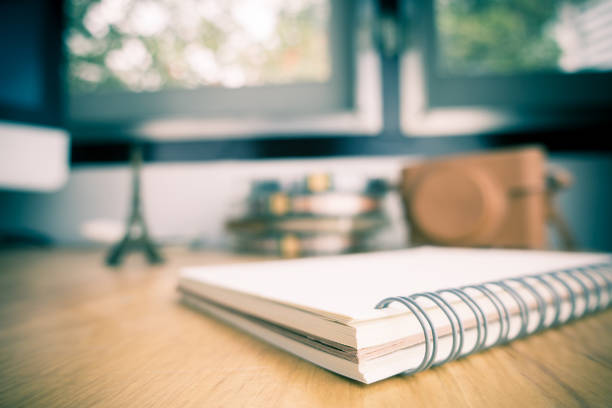 istock Travel blogger blank book on a working desk 661913164