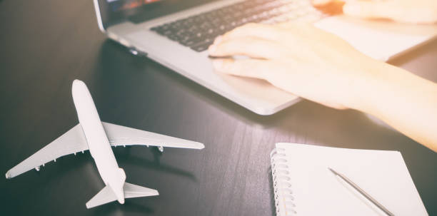 istock Officer worker is working on Travel agency office desk 661913204