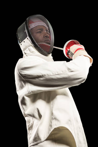 istock Man wearing fencing suit practicing with sword 661913834