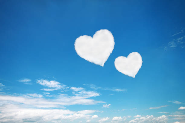 istock couple white heart shaped clouds on blue sky 661914604