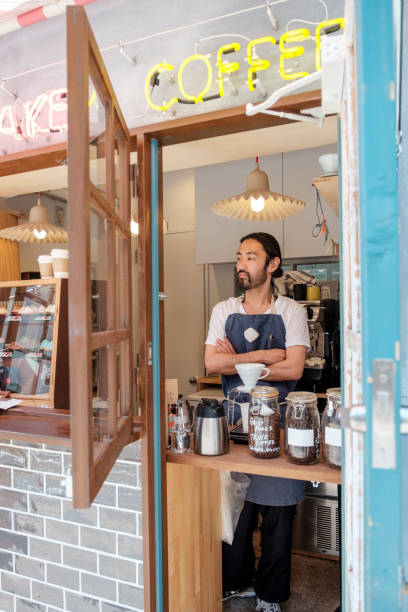 Japanese man working in a cupcake shop