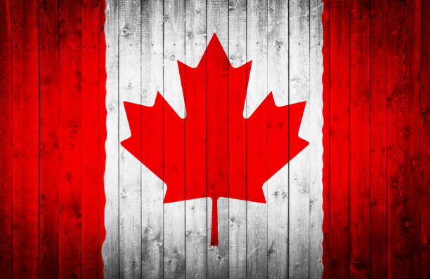 istock Canadian flag is painted on a wooden surface 661947306