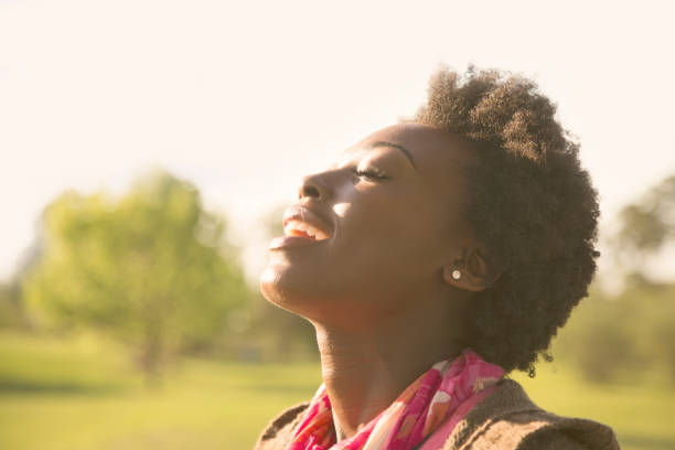 istock Woman enjoys feeling the sun on her face. 661952908