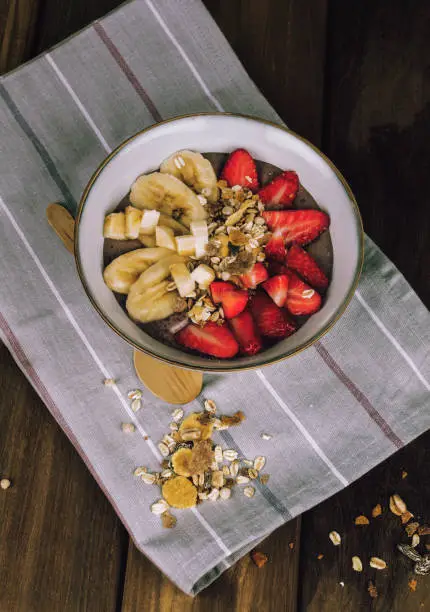 breakfast with banana, strawberries and nuts