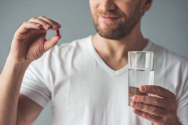 istock Handsome man with medicine 661954988