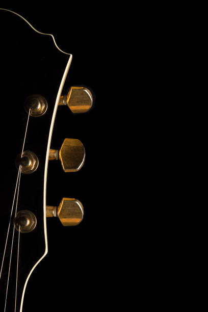 istock Guitar headstock on black background 661978588