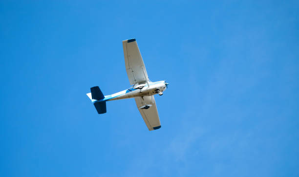 istock Pilot flying recreational airplane mid air flying in sky 662023596