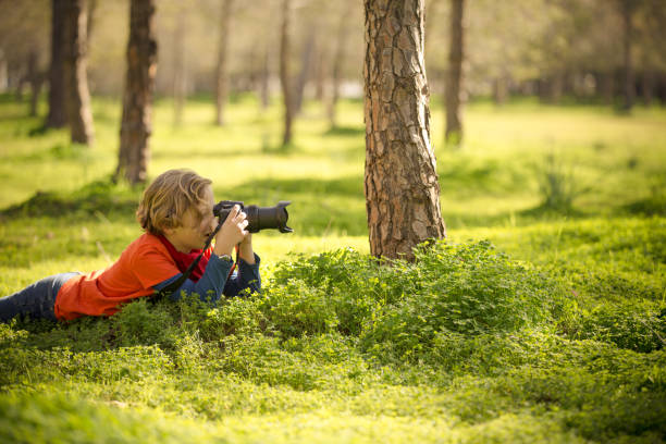 istock Photographing nature by a young boy 662032196