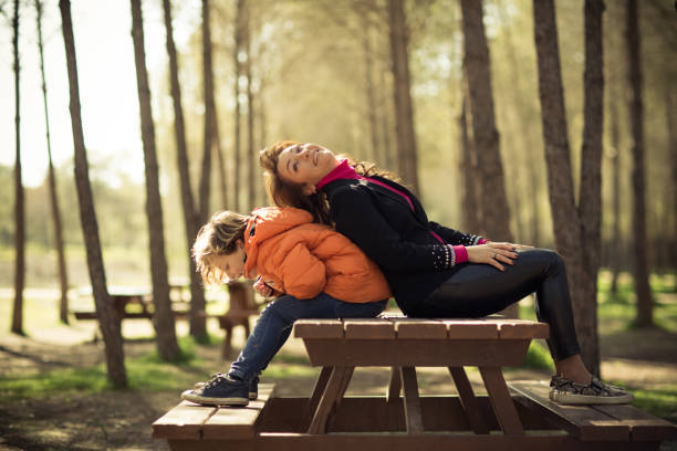 istock Happy mother and son in green park 662042292