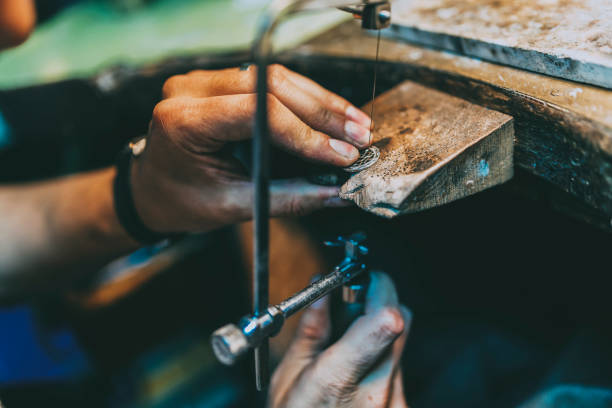 istock Jeweler crafting jewelry on his workbench 662051660